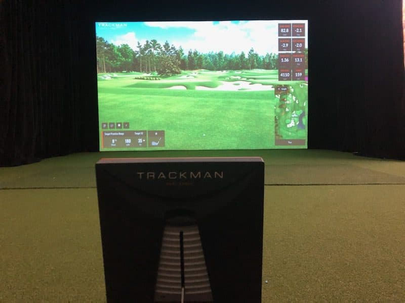 Custom in-home golf simulator with clean, built-in finish